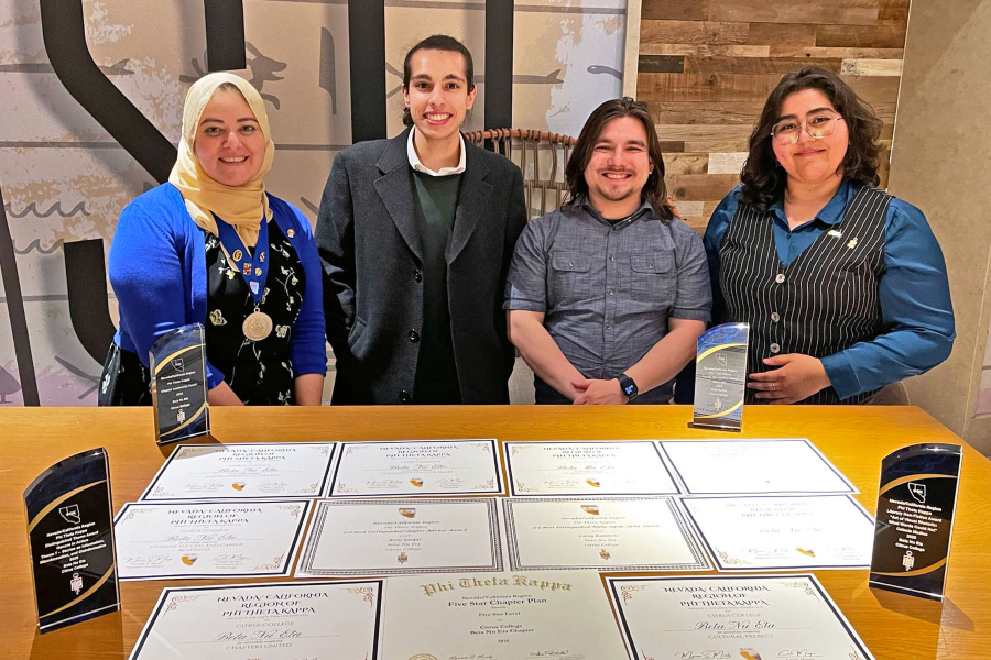 ptk students and advisor display awards and certificates earned by the beta nu eta chapter at citrus college