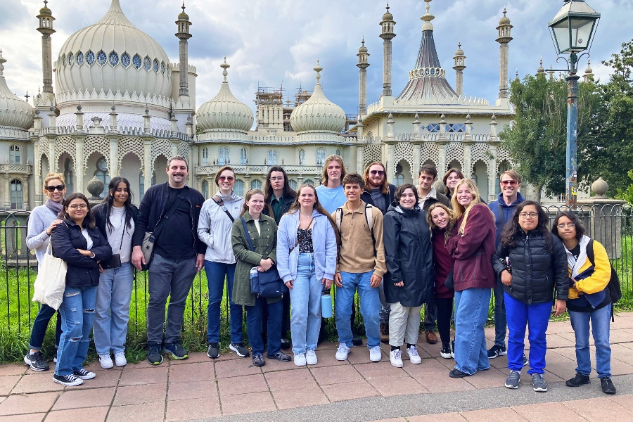 students and instructors pose in front of the royal pavilion during a study abroad trip in brighton, england