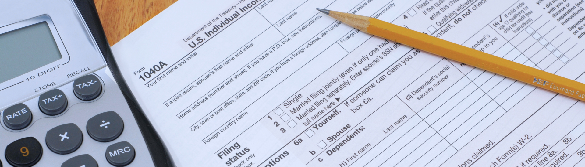 IRS 1040 form, pencil, calculator