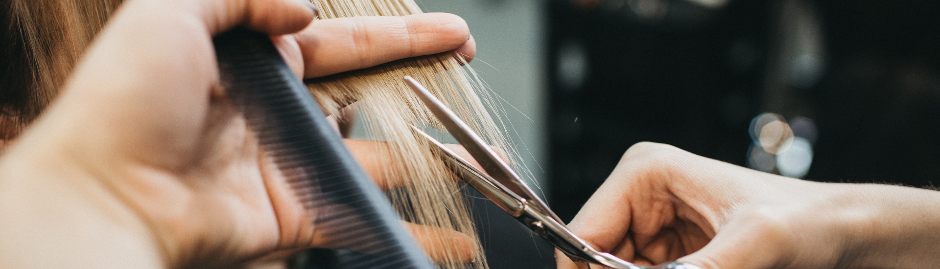 closeup of straight hair being trimmed