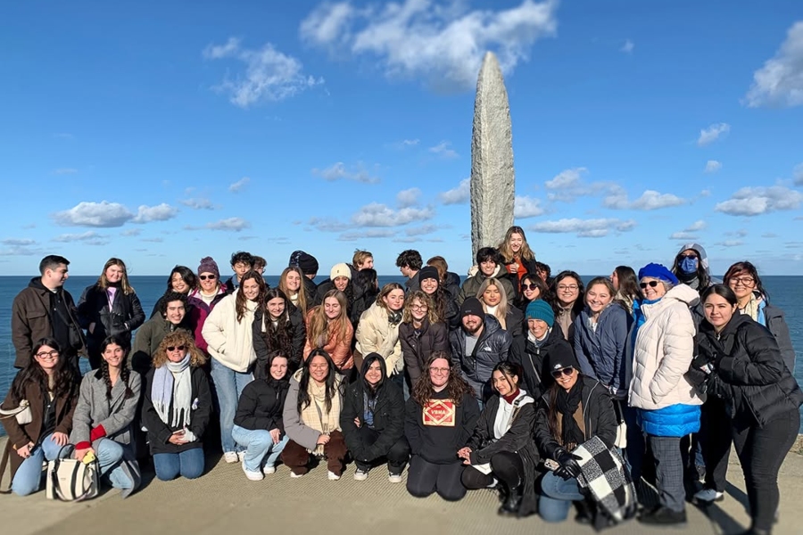 citrus college study abroad students gather at the pointe du hoc ranger monument overlooking the english channel in normandy, france