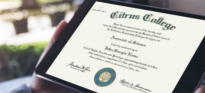image of a person holding a sample diploma on a tablet mobile device