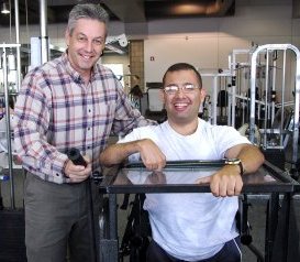 Instructor assisting student on stand-aid machine