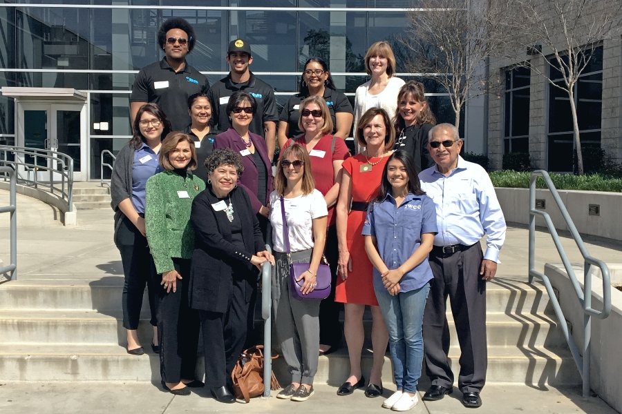 group of citrus college administrators community and business leaders standing together on campus steps outside a college building