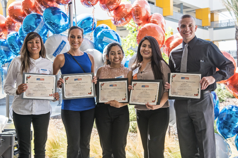 scholarship recipients hold certificates during the citrus college foundation scholarship reception and donor appreciation celebration