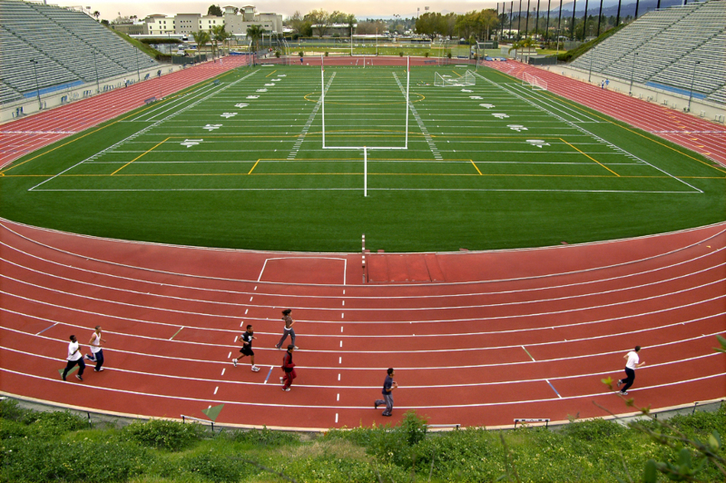 photo of people running on the all-weather track 