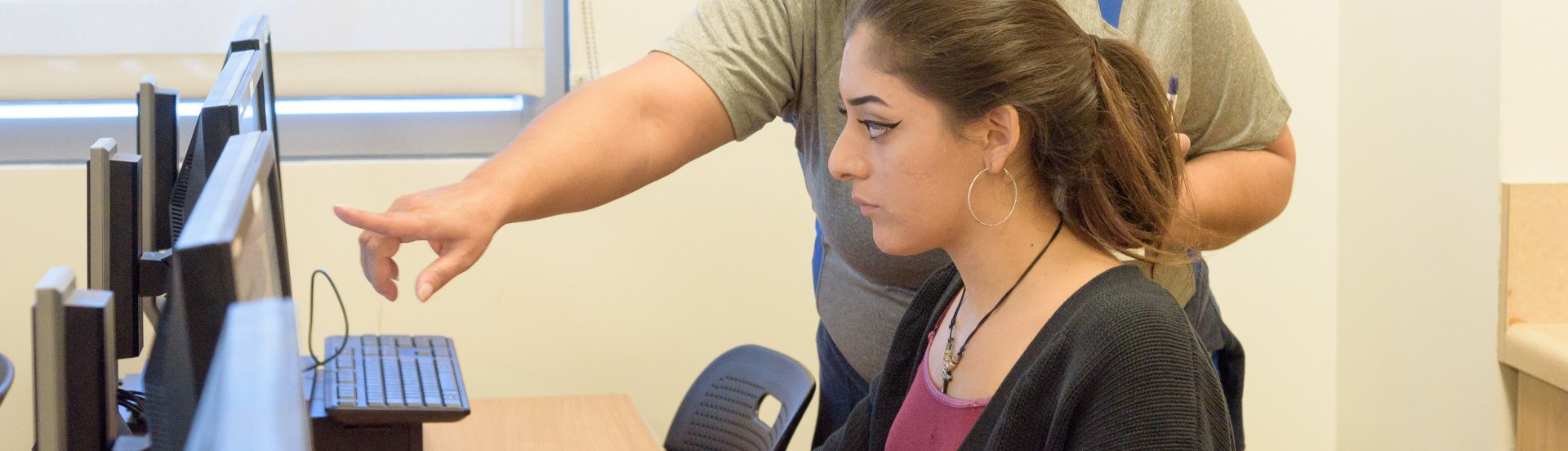 student receiving instruction and directive from a tutor