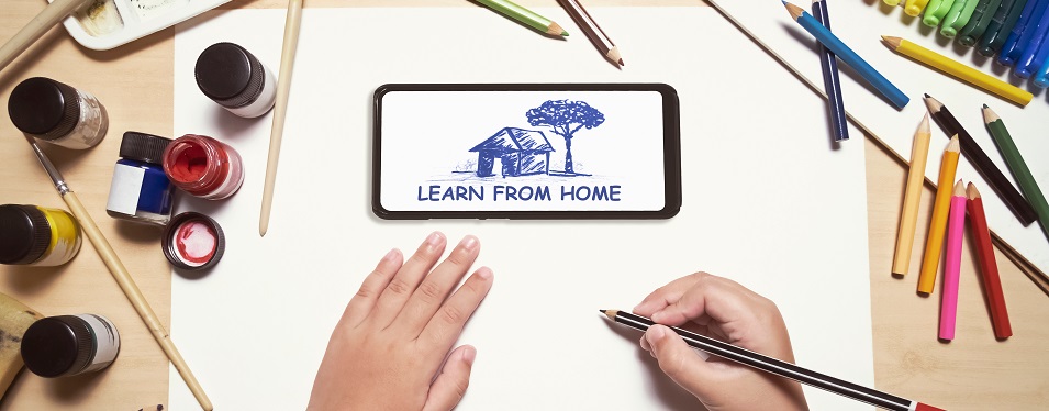 child drawing while looking at instructions on a smart phone