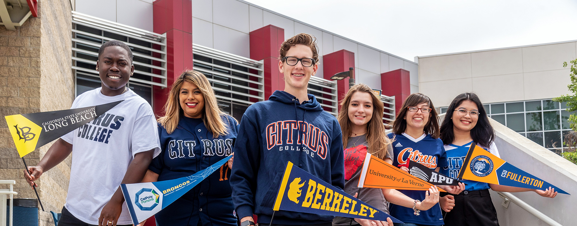 Citrus College students holding pennants to four-year college's and universities