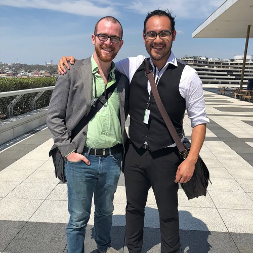 Abel Marquez, right, poses with another man outdoors during the kennedy center american college theater festival