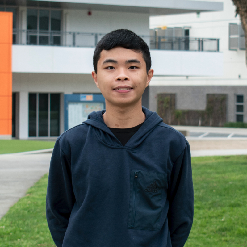 JiaJie Yang standing in front of the college's ED Building