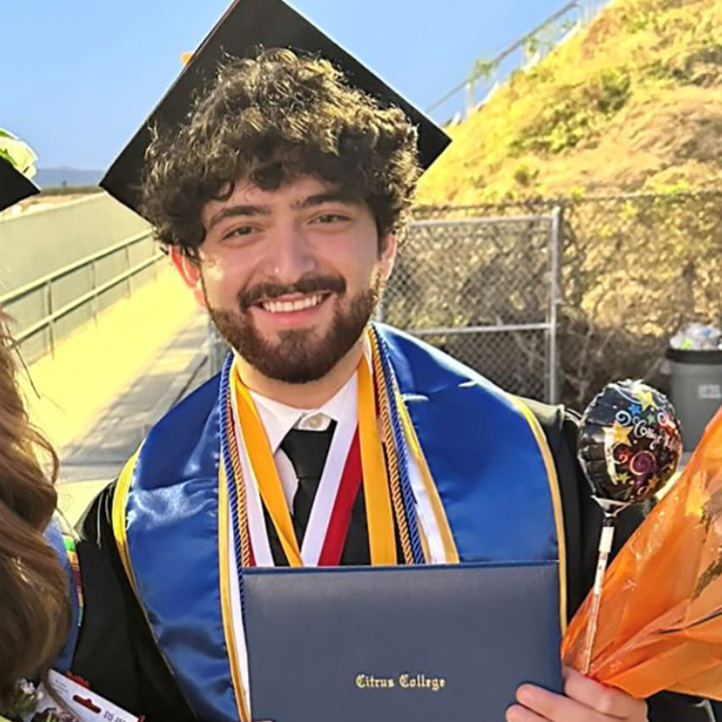 Riccardo Kessesshak after the Citrus College commencement ceremong in cap and gown