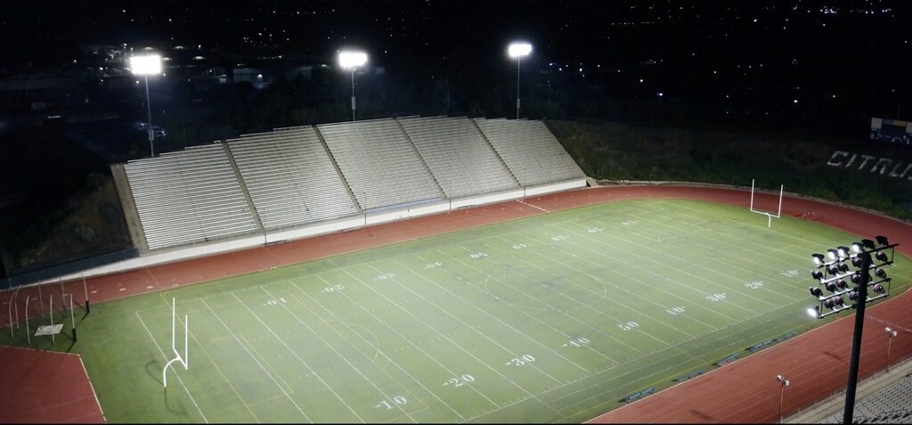 Bird's eye view of the stadium at night all lit up