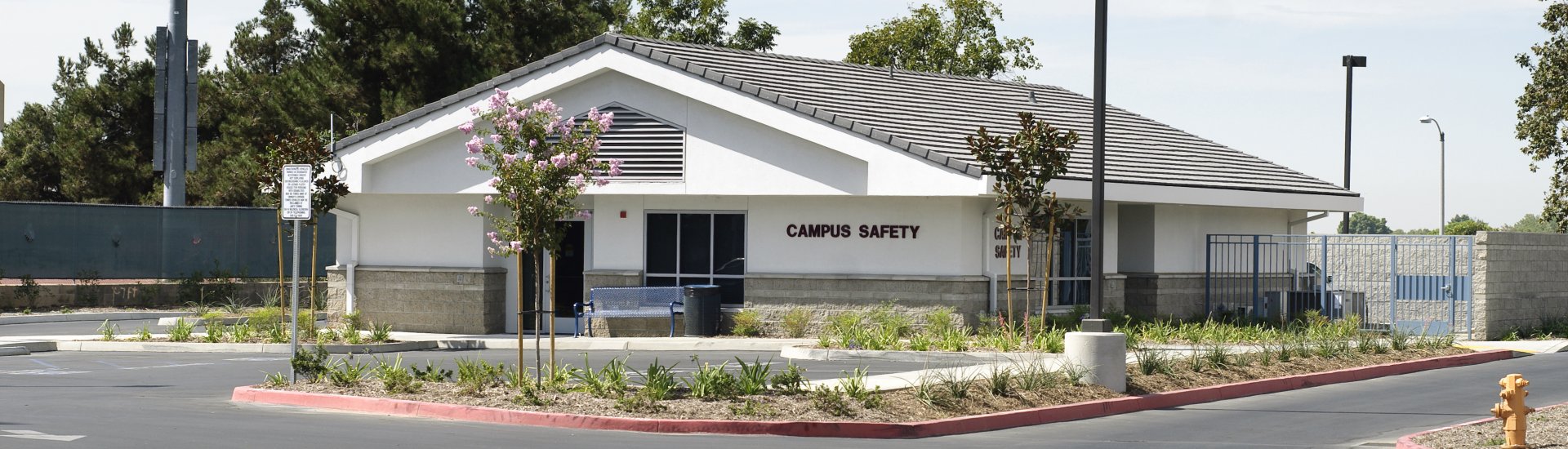 Campus Safety building located at the entry of the main parking lot at Citrus Avenue and Foothill Blvd.